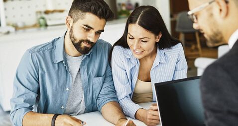 young couple deal contract real estate investment business agreement agent document signing meeting