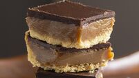 Scottish Caramel Slice or Millionaire's Shortbread Confectionery Dessert with Layers of Chocolate and Caramel over Shortbread Cr