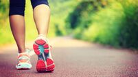 iStock-906730884.jpg Young fitness female runner legs ready for run on forest trail