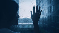 sad lonely depression mood woman silhouette touch glass windows rainy dark day outside