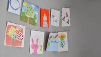 Child drawings hanging on the wall, preschool child painting, kids room, Children's creativity, empty space