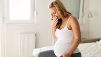 Pregnant woman suffering with nausea in morning