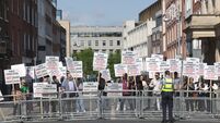 Heated scenes as far-right councillors heckle Independent TD at Leinster House protest