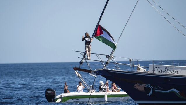 <p>Climate activist Greta Thunberg stands near a Palestinian flag after boarding the Madleen boat and before setting sail for Gaza along with activists of the Freedom Flotilla Coalition, departing from the Sicilian port of Catania, Italy.</p>