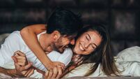 iStock-684757948.jpg Happy young couple in bed