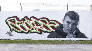 <p> A new mural by graffiti artist Aches Huis has been erected in Grand Canal Dock, Dublin, of Kneecap musician Liam Óg Ó hAnnaidh. Picture: Sam Boal/Collins Photos</p>