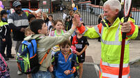 'You have to smile': Lollipop person of the year enjoys the craic with all his little charges