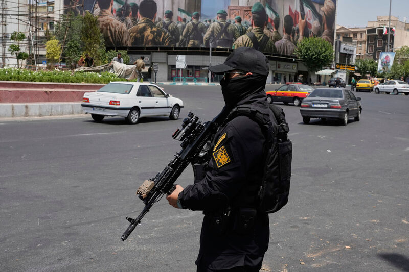 A member of Iran's Revolutionary Guard stands guard at Enqelab-e-Eslami (Islamic Revolution) square in downtown Tehran, Iran, Tuesday, June 24, 2025. (AP Photo/Vahid Salemi) A member of Iran's Revolutionary Guard stands guard at Enqelab-e-Eslami (Islamic Revolution) square in downtown Tehran, Iran, Tuesday, June 24, 2025. (AP Photo/Vahid Salemi)
