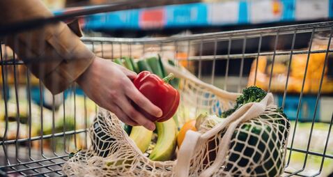 Grocery Shopping With Reusable Shopping Bag At Supermarket